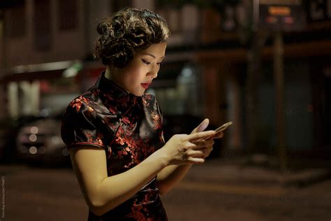 asian woman on mobile phone by stocksy contributor eyes on asia