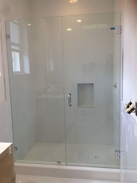 view  small frameless sliding glass shower doors