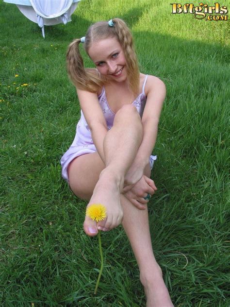 sexy blonde teen sucks her toes on the grass coed cherry