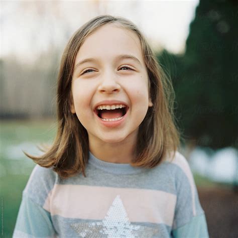 cute young girl laughing  stocksy contributor jakob lagerstedt