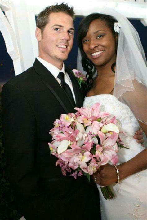 beautiful interracial couple on their wedding day if u r