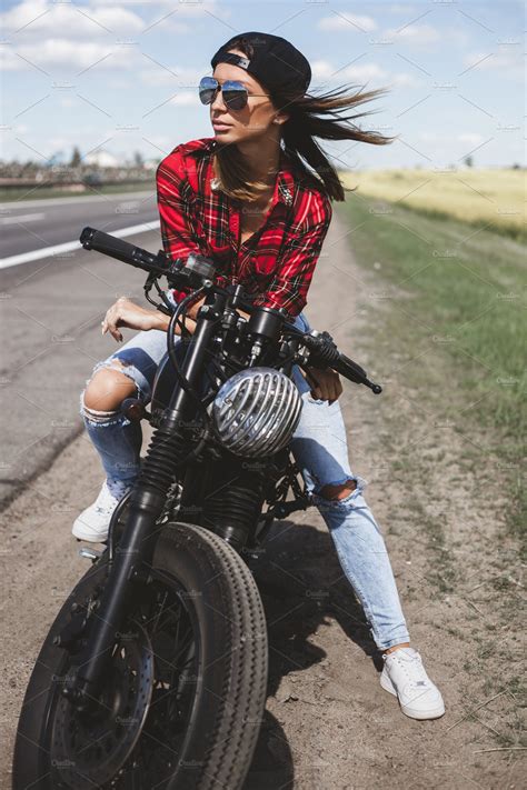 biker girl sitting on motorcycle high quality people images