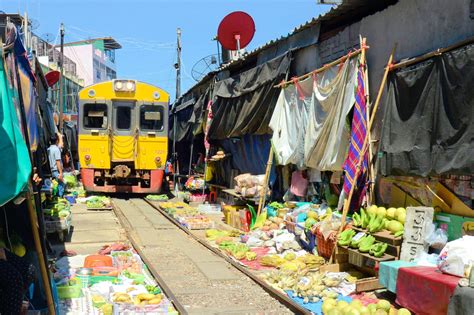 maeklong railway market famous local market  bangkok  guides