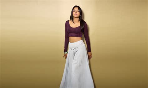 Woman Wearing Maroon Scoop Neck Long Sleeved Crop Top With White Maxi