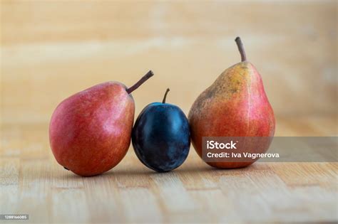 Group Of Pears And Blue Plums Edible Fruits Tasty Ripened Red Yellow