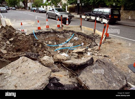 road works repair street crater dig digging pipe pipework roadworks