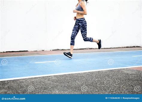 white woman running  track stock photo image  motion active