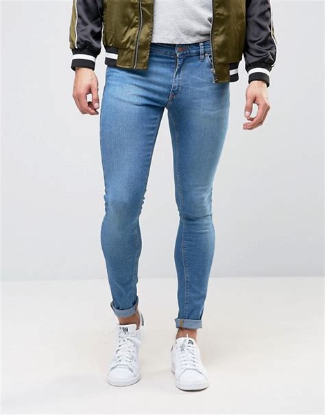 asos design extreme super skinny jeans in mid blue asos