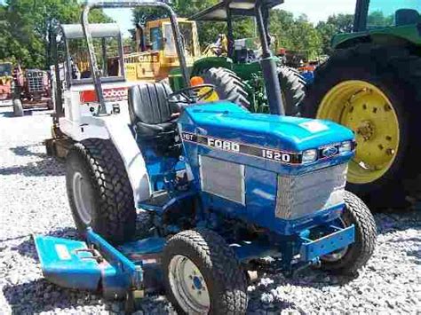 ford  holland  compact tractor   mower aug   gw mcgrew auction