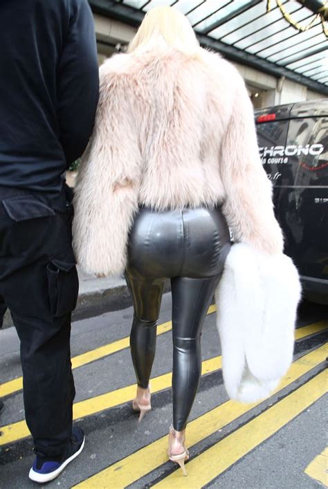 newly blonde kim kardashian squeezes her famous bum into super tight silver latex leggings