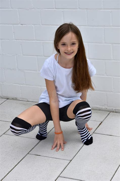 teenage girl crouching stock image image of length freckles 72560113