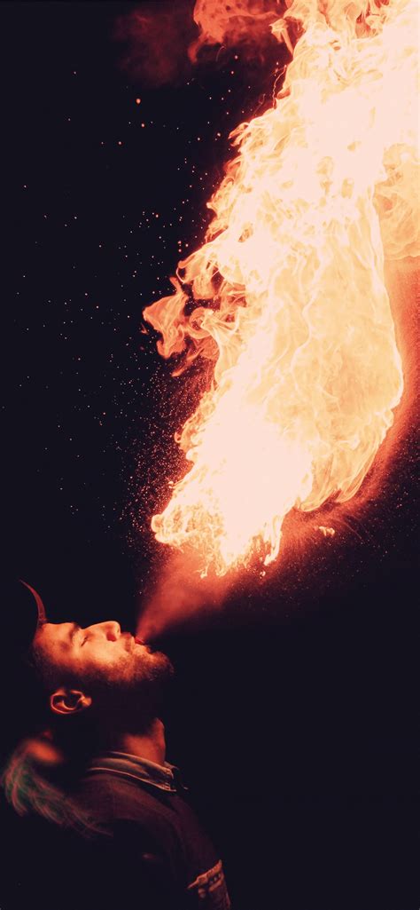 man blowing fire iphone wallpapers