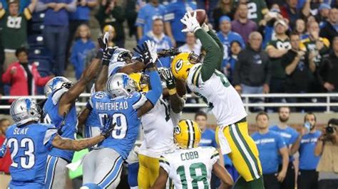 green bay packers stun detroit lions on aaron rodgers hail mary td