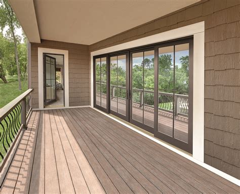 large deck  sliding glass doors leading   patio