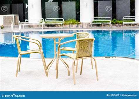 table  chairs  swimming pool stock photo image