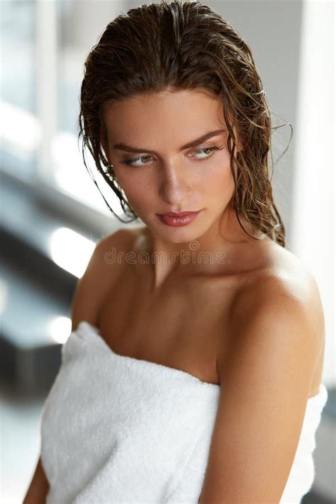 Body Care Beautiful Woman With Wet Hair In Towel After Bath Stock
