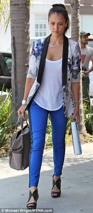jessica alba is a beauty in skinny blue jeans and a fashion forward floral jacket as she heads