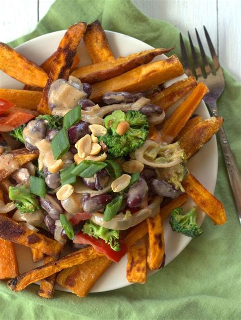 these thai curry sweet potato fries are made with crispy baked sweet potato strips smothered in