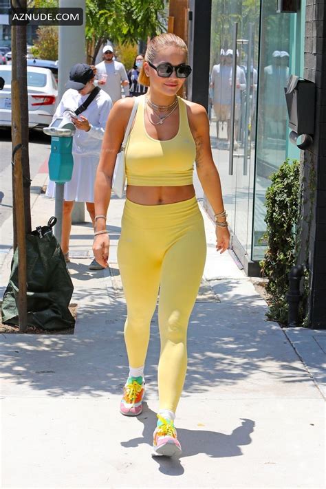 rita ora sexy flaunts her sensational physique in all yellow gym wear