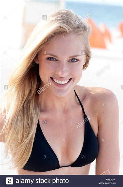 Female With Long Straight Blonde Hair Wearing Black