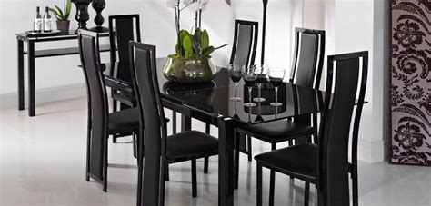 noir extending dining table  black upholstered chairs  harveys