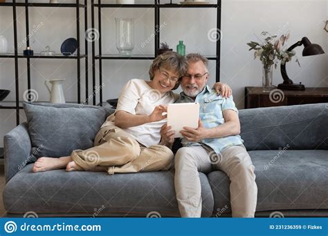 Happy Bonding Mature Couple Using Digital Tablet Stock Image Image