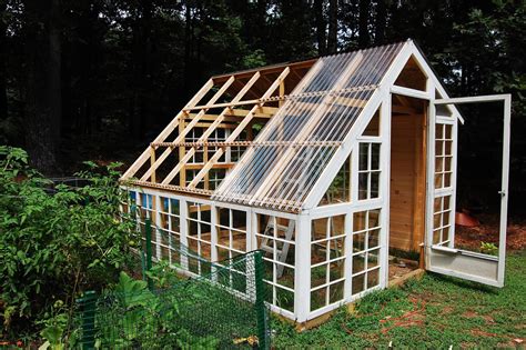 custom backyard greenhouse  recycled windows