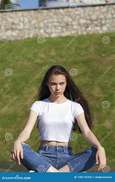 Young Beautiful Teenager Girl Posing Against Summer Park Bright Sunny