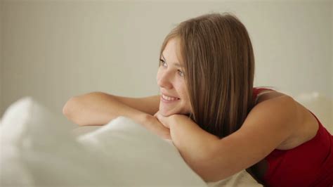 relaxed person smiling on couch stock footage sbv 303976049 storyblocks