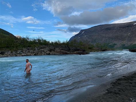 skinny dipping in a cold river above the arctic circle in kaitumjaure