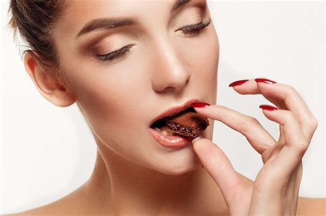 Premium Photo Lovely Smiling Teenage Girl Eating Chocolate