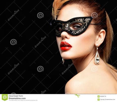 beauty model woman wearing venetian masquerade carnival mask at party
