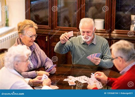 senior people playing card games stock photo image  health couple