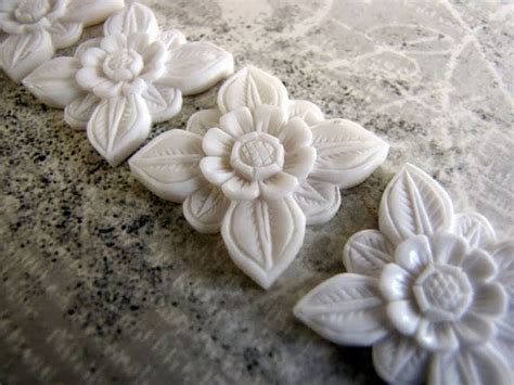 17 best images about jewelry carved bone coral on pinterest pendants lotus and earrings