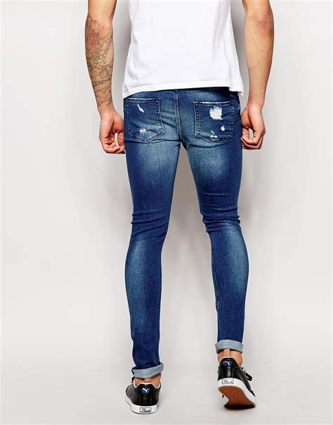 asos extreme super skinny jeans with mega rips in blue for men lyst