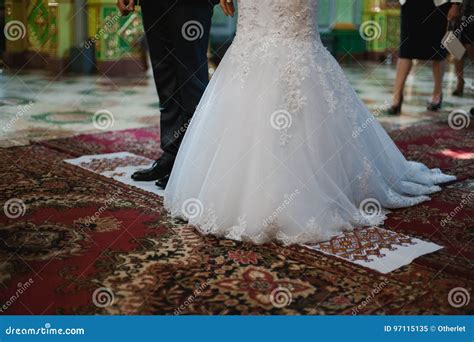 couple  standing   embroidered towel stock image image  foot