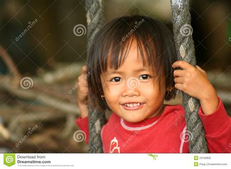 Indonesian Girl On A Swing Editorial Photography Image