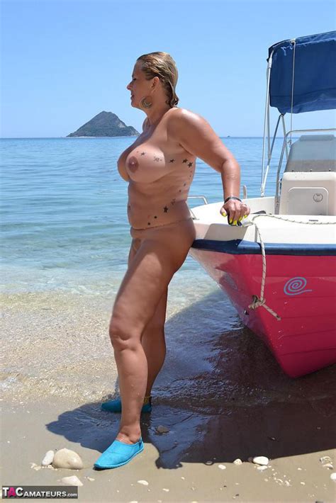 beefy big nude chrissy pilots her boat naked to sun her round plump tits