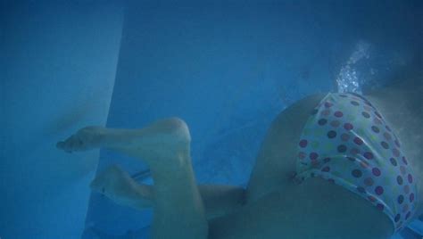 blonde teen at public pool with underwater shots