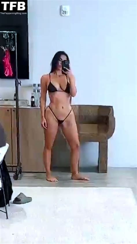 kim kardashian shows off her curves in a micro bikini 8 pics video