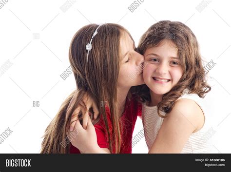 two sisters kissing image and photo free trial bigstock