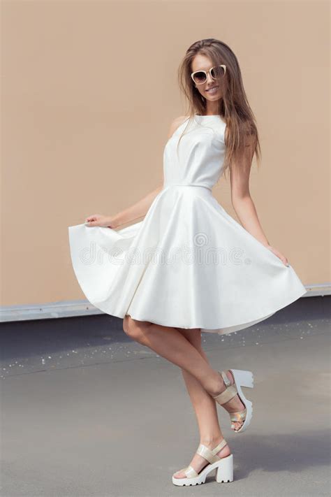 pretty sweet beautiful girl in a bright white dress in