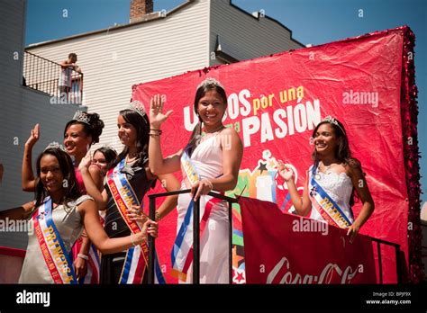 hispanic beauty queens travel on a float sponsored by coca cola in the
