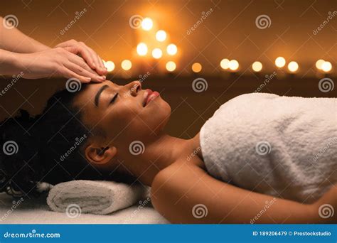 Indian Massage In Romantic Atmosphere For Black Woman Stock Image