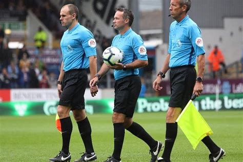 officials in football roles and responsibilities of a referee uk