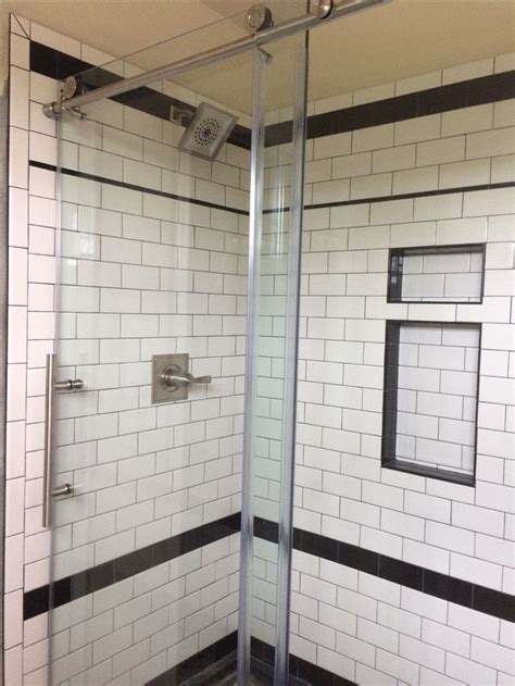love    shower white subway tiles  black grout
