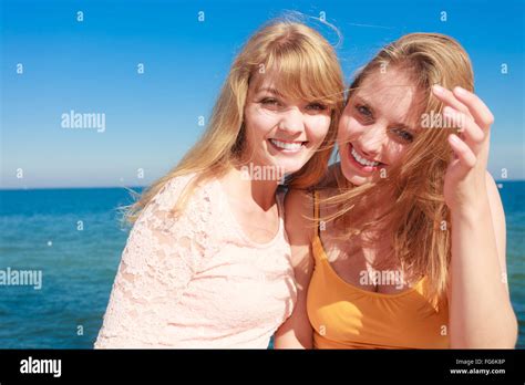 Two Young Women Best Friends Blonde Cheerful Girls Having Fun Outdoor