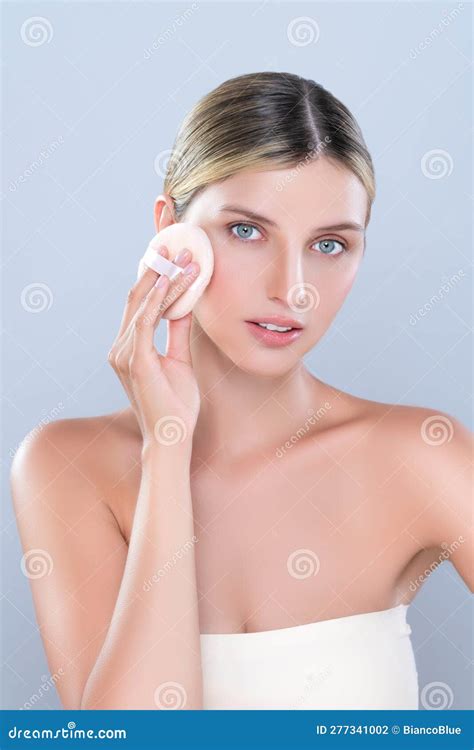 Alluring Beautiful Female Model Applying Powder Puff For Facial Makeup
