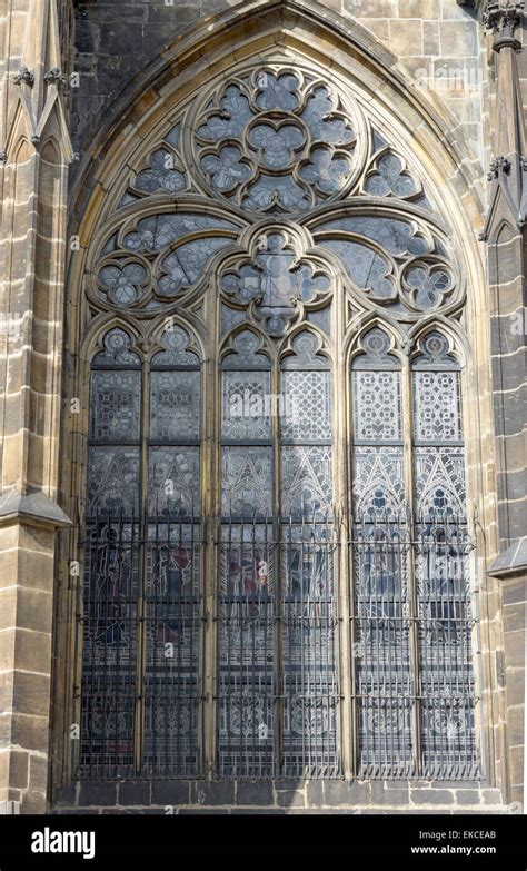 exterior view of stained glass window with tracery of cut stone in