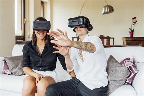 Young Lesbians Gesturing While Enjoying Virtual Reality Through